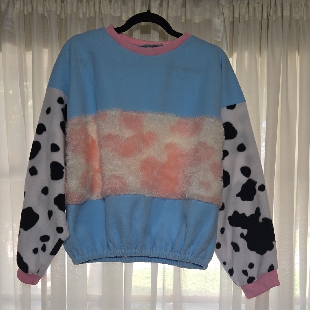 Cute and Quirky Pastel Women's Sweatshirt with Cow Print Sleeves